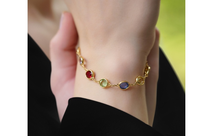 Gold and stone bracelets are colorful.